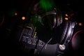 In selective focus of Pro dj controller.The DJ console deejay mixing desk at music party in nightclub with colored disco lights. Royalty Free Stock Photo