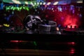 In selective focus of Pro dj controller.The DJ console deejay mixing desk at music party in nightclub with colored disco lights. Royalty Free Stock Photo