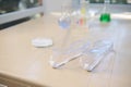 Selective focus on protective goggles against the background of laboratory glassware on the table Royalty Free Stock Photo