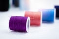 In selective focus of purple color thread on background,needlework,craft,sewing and tailoring concept Royalty Free Stock Photo