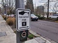 Selective focus on a `push button to cross street` crosswalk sign in downtown Bellevue Royalty Free Stock Photo