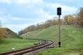 Selective focus railway green lantern of semaphore railroad enable, allow permit track that twists and turns between