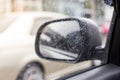 Selective focus of Raindrops on the car side mirror on  blurred background Royalty Free Stock Photo