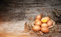 In selective focus of raw eggs on hemp cloth,plenty of dried leaf around,Crushed egg put on to Royalty Free Stock Photo