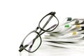 selective focus on reading eyeglasses with stacking of newspaper Royalty Free Stock Photo