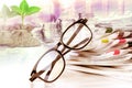 selective focus on reading eyeglasses with stacking of newspaper Royalty Free Stock Photo