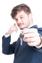 Selective focus of real estate agent showing keying and calling