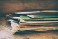 Selective focus of records stack with record on top over wooden table. vintage filtered Royalty Free Stock Photo