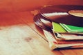 Selective focus of records stack with record on top over wooden table. vintage filtered Royalty Free Stock Photo