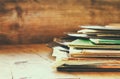 Selective focus of records stack with record on top over wooden table. vintage filtered Royalty Free Stock Photo