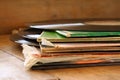 Selective focus of records stack with record on top over wooden table. vintage filtered Royalty Free Stock Photo
