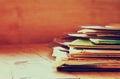 Selective focus of records stack with record on top over wooden table. vintage filtered Royalty Free Stock Photo