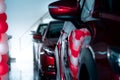 Selective focus red SUV car parked in modern showroom. Car dealership concept. Automotive industry. Auto leasing business. Luxury Royalty Free Stock Photo