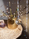Selective focus on round ball shape crystal rainbow maker suncatcher hanging in home with Orgonite or Orgone pyramid. Good Feng Sh