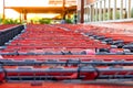 Selective focus on row of shopping carts at supermarket entrance Royalty Free Stock Photo