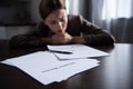 Focus of sad woman at table with divorce documents