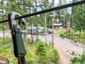 Selective focus on a safety clip used on a high wire ropes course Royalty Free Stock Photo