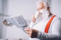 Santa claus reading newspaper Royalty Free Stock Photo