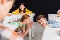 Selective focus of schoolkids gossiping near Royalty Free Stock Photo