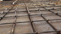 Screw thread steel bar framework in the construction site. Steel Rebars for reinforced concrete. Building Construction background