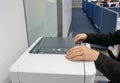 Close up secretary with black suit uses office printer for copying and scanning the important documents Royalty Free Stock Photo