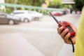 Selective focus of the Security guard uses radio communication for facilitate traffic. Traffic Officers use radio communication to