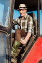 selective focus of self-employed senior man driving tractor. Royalty Free Stock Photo