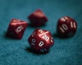 Selective focus of a set of red dice with numbers, on a blue fabric Royalty Free Stock Photo