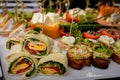 Selective focus. Several pieces healthy fresh chicken and salad wraps. Fresh tortilla wraps with salads and cheese