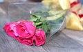 Selective focus and shallow depth of field of bouquet of beautiful red roses on old wooden board background Valentine`s day conce Royalty Free Stock Photo