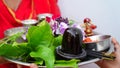 Selective focus on Shivlinga statue. Black marble statue as a sign of Lord Shiva. Hindu religion and culture concept