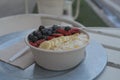 Selective focus shot of an Acai Bowl filled with blueberries, strawberries, and bananas Royalty Free Stock Photo