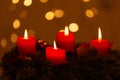 Selective focus shot of an advent wreath decoration with lighted red candles. perfect for wallpaper Royalty Free Stock Photo
