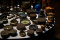 Selective focus shot of antique rare items collection including old compasses and elephant statues