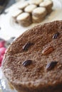 Selective focus shot of baked cake of almonds, nuts and pistachio