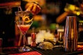 Selective focus shot of a barman pouring a fresh alcoholic drink into the glass on the bar counter Royalty Free Stock Photo