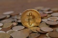 Selective focus shot of a bitcoin in a pile of other coins Royalty Free Stock Photo