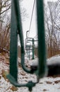 Selective focus shot of chairlifts on a ski mountain during winter