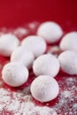 Selective focus shot of Chinese sweet dumplings on a red background Royalty Free Stock Photo