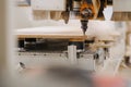 Selective focus shot of a chipboard milling machine Royalty Free Stock Photo
