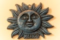 Selective focus shot of a clay sun souvenir from Mexic