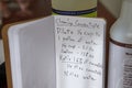 Selective focus shot of cleaning concentrate handwritten recipe next to cleaning products