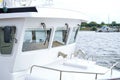 Selective focus shot of the deck and windows of a modern, white boat Royalty Free Stock Photo