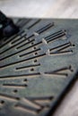 Selective focus shot of the details of a metal sundial