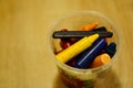 Selective focus shot of different color crayons in a plastic jar Royalty Free Stock Photo