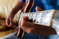 Selective focus shot of an elderly male playing an electric guitar Royalty Free Stock Photo