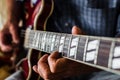 Selective focus shot of an elderly person playing the guitar Royalty Free Stock Photo