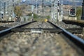 Selective focus shot of empty railroad tracks and semaphores with red lights Royalty Free Stock Photo