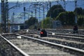 Selective focus shot of empty railroad tracks and semaphores with red lights Royalty Free Stock Photo