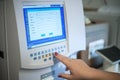 Selective focus shot of a female doctor adjusting the CBC (complete blood count) blood test machine Royalty Free Stock Photo